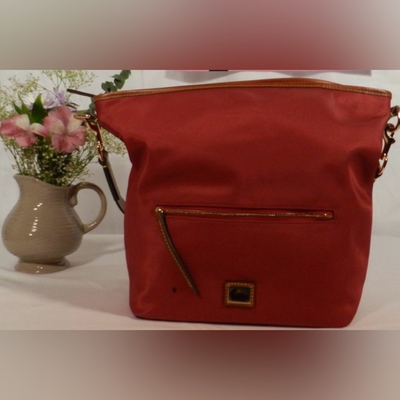 Dooney & Bourke Handbags - Dooney & Bourke Nylon HoBo - Raspberry mark on rt.